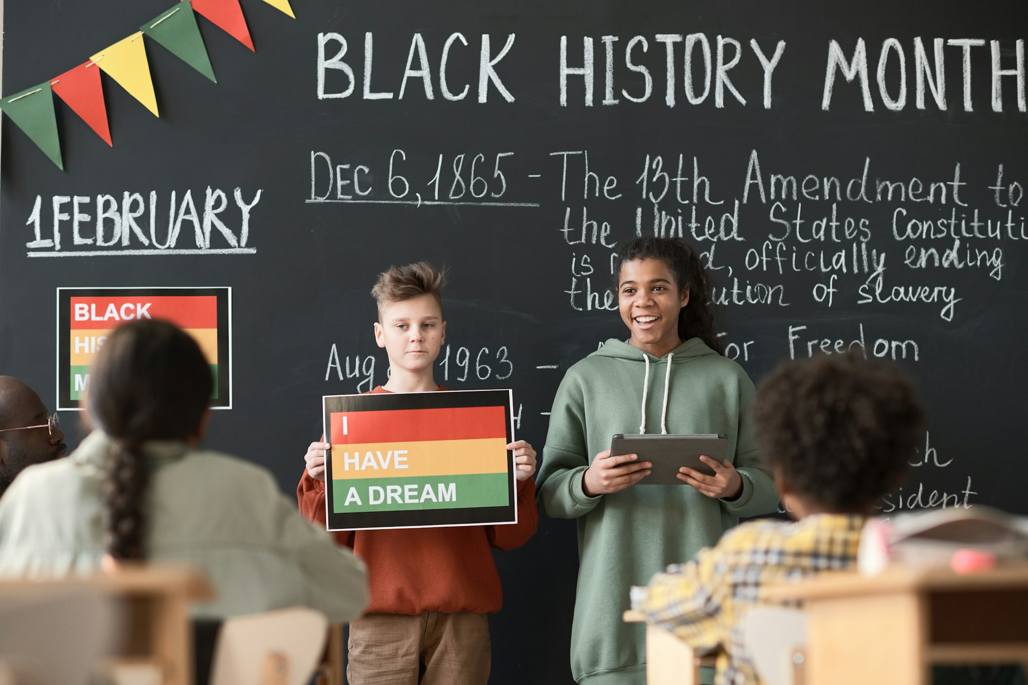 Children giving presentation for classmates